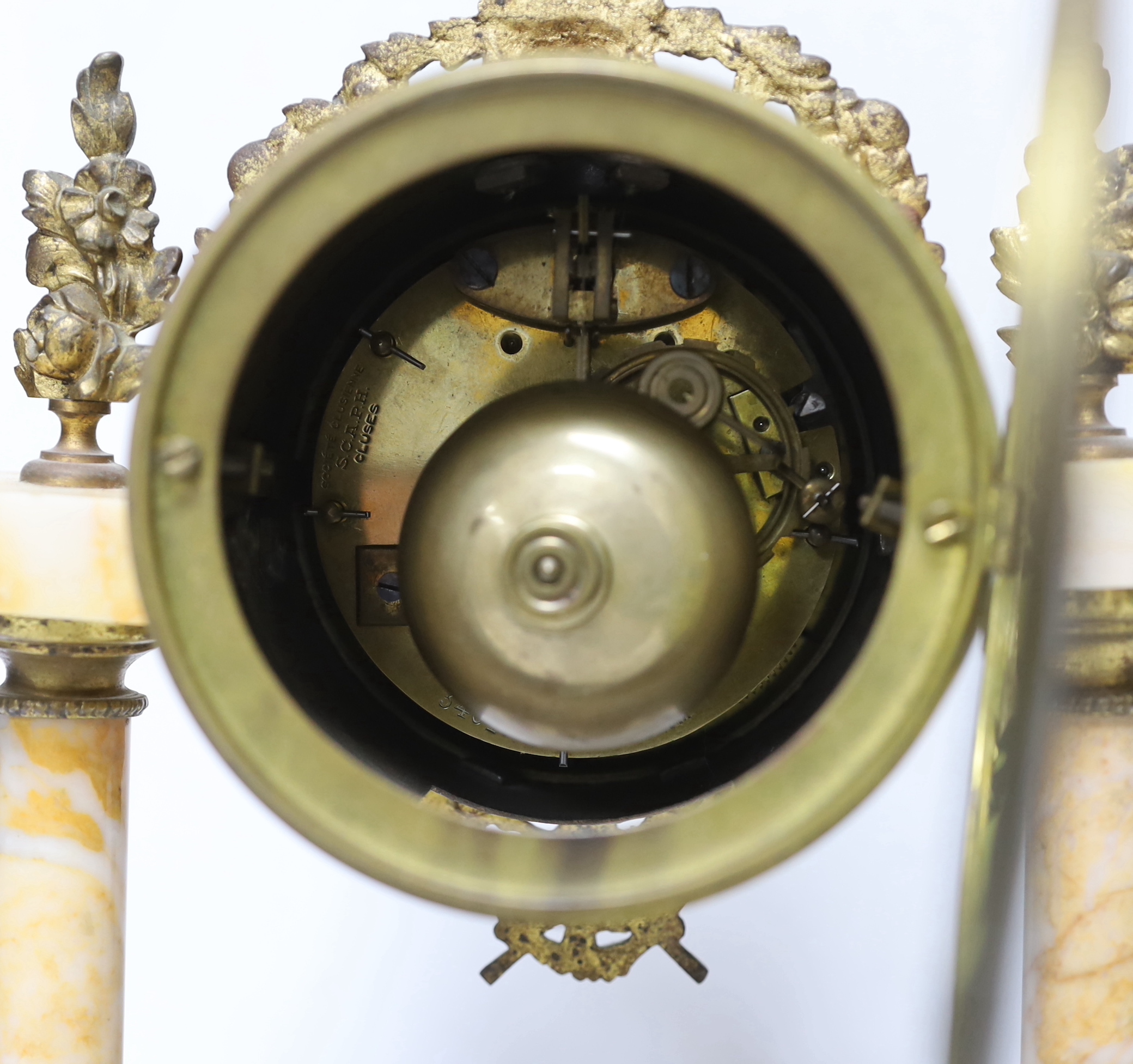A late 19th century French gilt metal and variegated marble eight day pillar clock, 37cm high